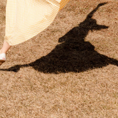 Emily Gilmore—Girl in yellow dress walking in backyard