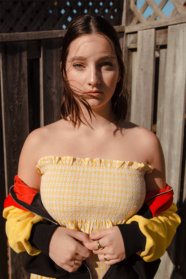 Emily Gilmore—Girl in yellow dress in backyard
