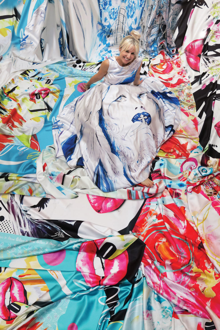Stella Jurgen lays on art prints