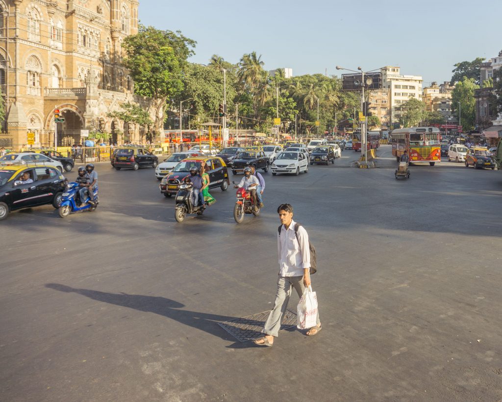 Man crossing street in Mumbai