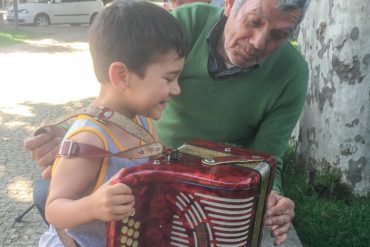 boy and grandfather concertina in Portugal