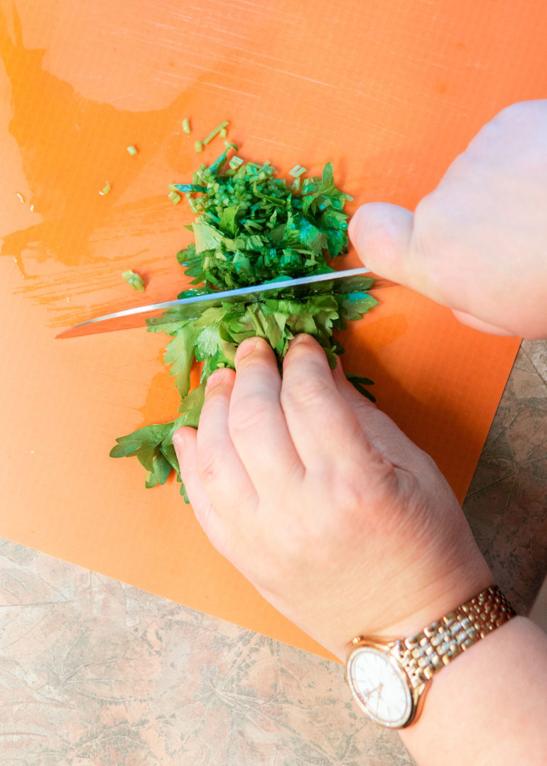 chopping parsley for octopus salad